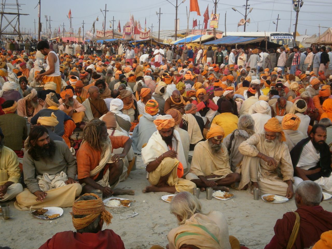 A vibrant scene of pilgrims at the Kumbh Mela in Prayagraj, showcasing spirituality and traditional culture.
