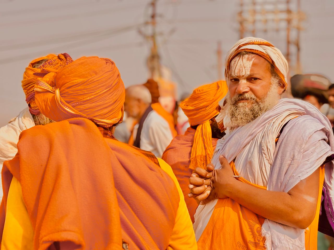Traditional Indian attire at Kumbh Mela, a vibrant festival in Prayagraj, India.
